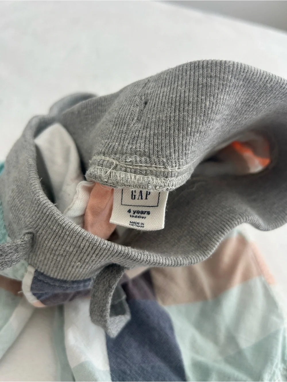 GAP Kids Drawstring Hat in Gray with Pastel Stripe Panels